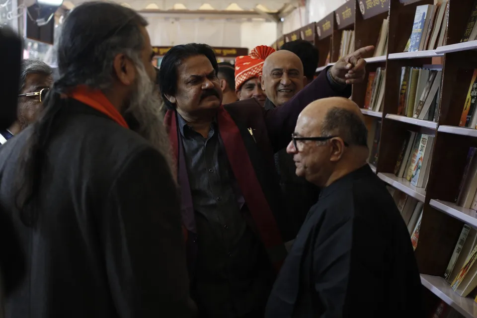 Visitors browse books at a stall