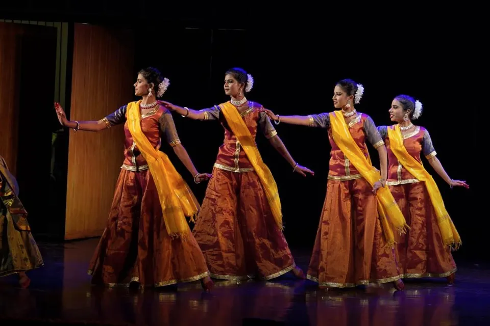 Group classical dance with yellow dupattas