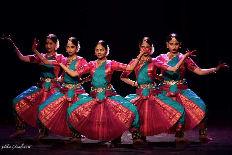 Bharatanatyam ensemble in a seated pose