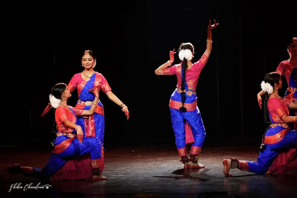 Dancers in blue and pink on stage