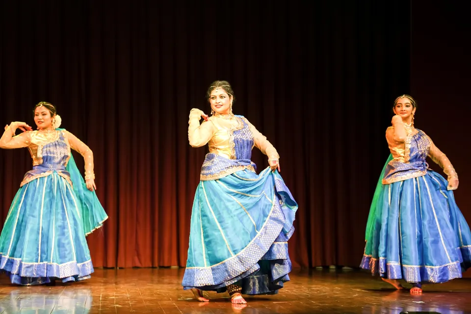 Three dancers in blue ghagras